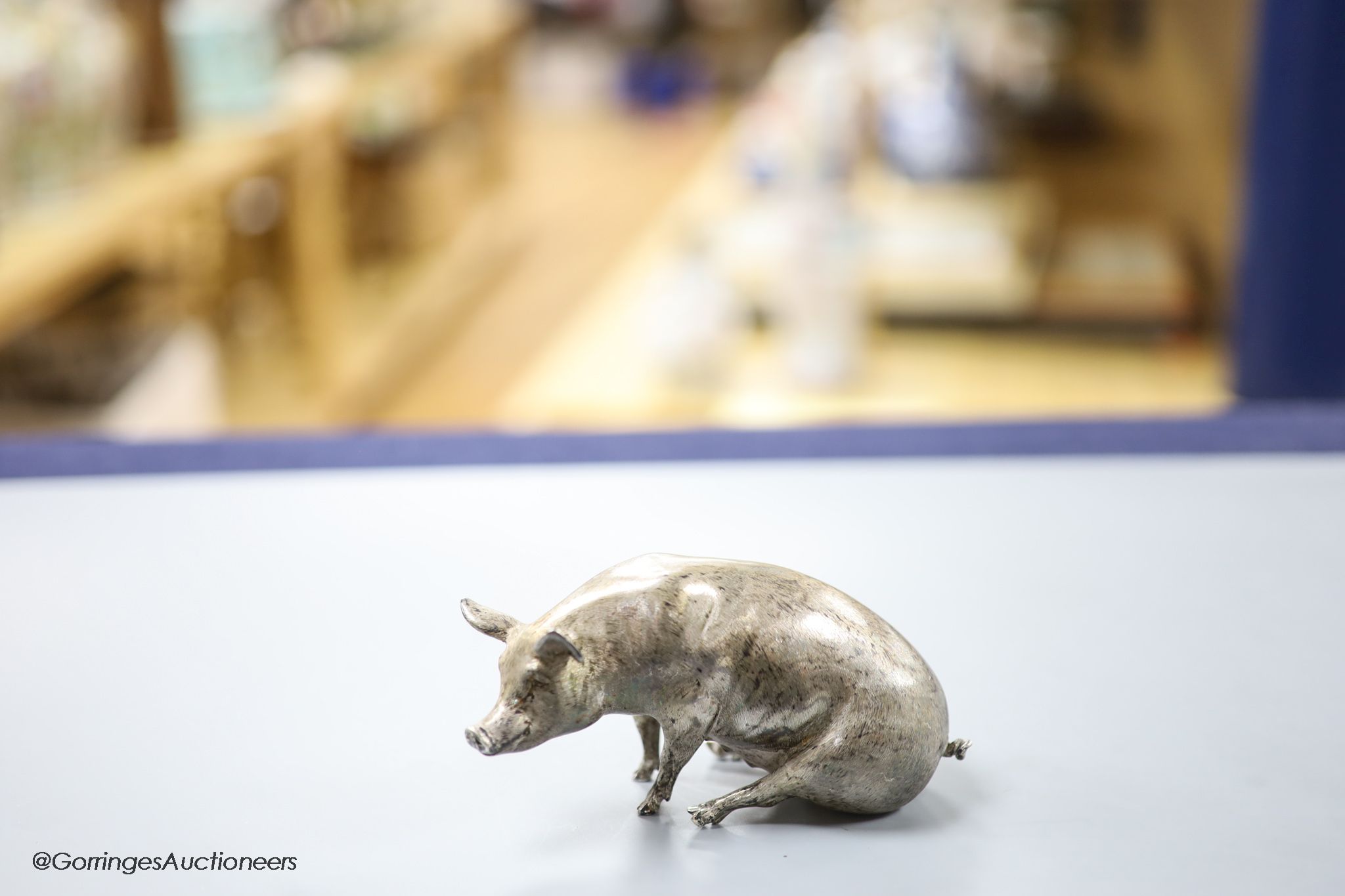 A modern silver miniature model of a seated pig, C.F.H & Co, London, 1993, height 65mm, 302 grams.